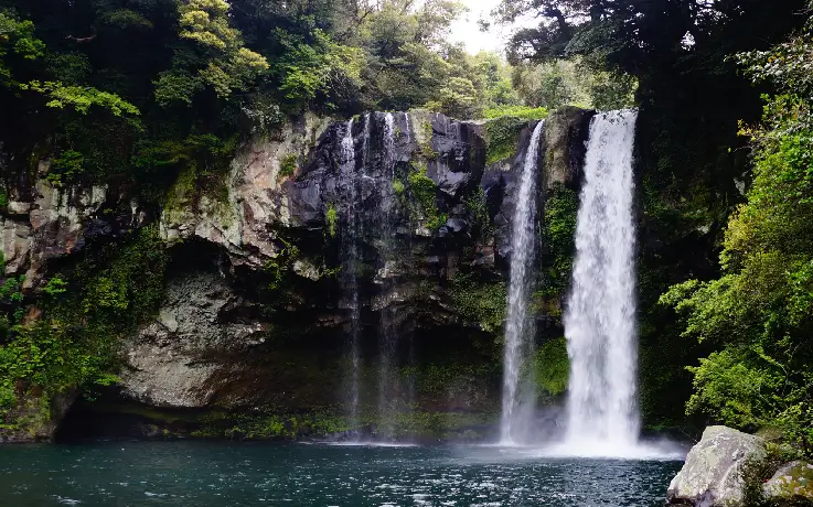 View of the majestic three-tiered Cheonjiyan Falls on Jeju Island